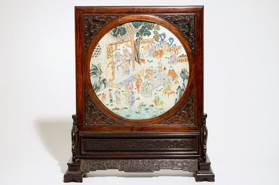 A Chinese zitan and huanghuali wood table screen with famille rose inset plaque, early 19th C.