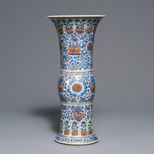 A clobbered Chinese blue and white 'gu' beaker vase, Kangxi — photo 1