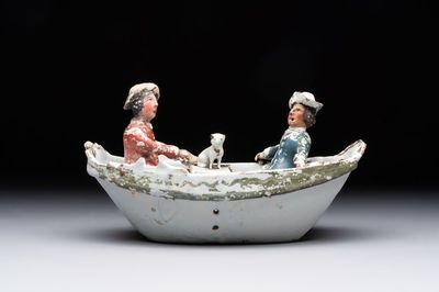 A cold-painted white Dutch Delft 'rowing boat' group, 18th C.
