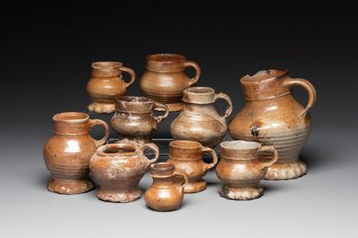 A collection of 10 German stoneware mugs, 14/16th C.