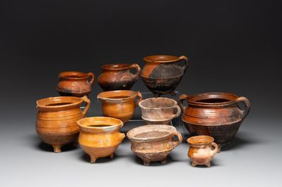 A collection of 10 parcel-glazed pottery so-called ‘grapen’, tripod cooking pots, 14th/17th C.