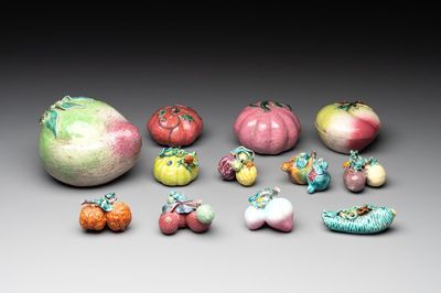 A collection of 12 Chinese famille rose fruit models, including a peach-shaped box and cover, 19th C.