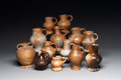 A collection of 13 German stoneware jugs, 15th C. and later
