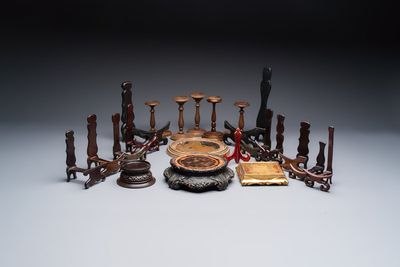 A collection of 21 wooden stands, 20th C.