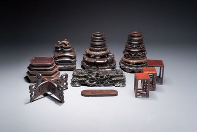 A collection of 25 Chinese wooden stands, 19/20th C.