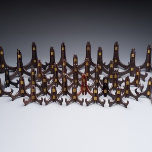 A collection of 35 Chinese folding wooden plate stands, 20th C. — photo 1