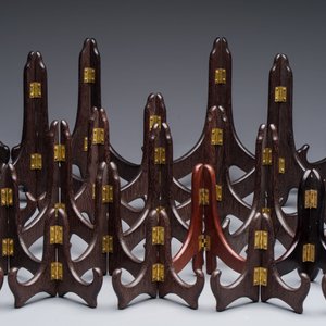 A collection of 35 Chinese folding wooden plate stands, 20th C. — photo 2