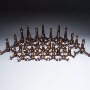 A collection of 35 Chinese wooden folding plate stands, 20th C. — photo 1
