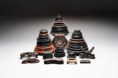 A collection of 37 Chinese wooden stands, 19/20th C.