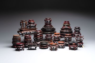 A collection of 45 Chinese wooden stands, 19/20th C.