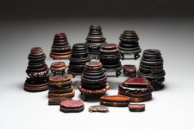 A collection of 51 Chinese wooden stands, 19/20th C.