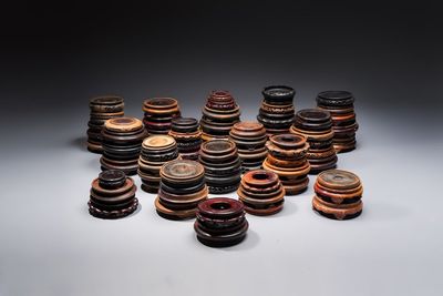 A collection of 75 Chinese wooden stands, 19/20th C.