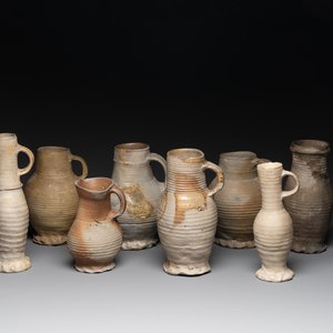 A collection of 8 German proto stoneware ribbed jugs, including 'Jacobakans', 14th C. — photo 1