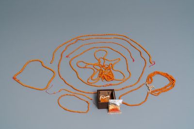 A collection of Chinese necklaces with red coral beads and loose beads, 19/20th C.