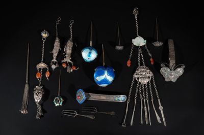 A collection of Chinese silver jewellery, some pieces adorned with enamel and precious stones, 19/20th C.
