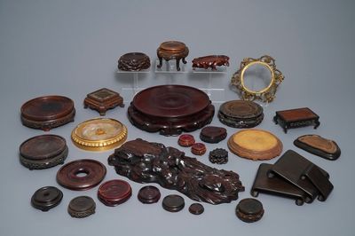 A collection of Chinese stands in carved wood and gilt bronze, 19/20th C.