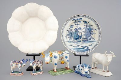 A collection of Dutch Delftware: a monochrome white dish, a cardinal's dish and 5 cows, 17/19th C.