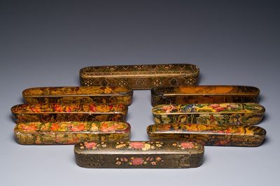 A collection of eight lacquered papier-maché pen boxes or qalamdans, Qajar, Persia, 19th C.