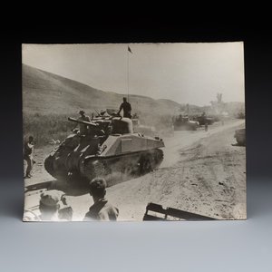 A collection of eight U.S. Signal Corps press photographs on the first China convoy over the Stilwell Road — photo 6