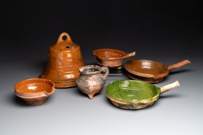 A collection of five glazed pottery cooking utensils and a fire bell, probably The Netherlands, 17th C.
