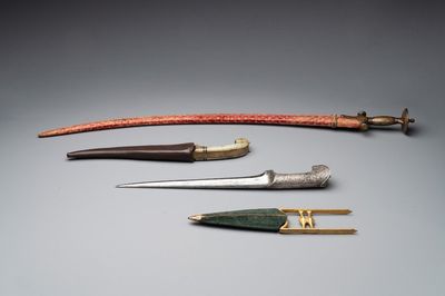 A collection of three daggers decorated with jade, silver and gold and an Indian mogul sword, India, 17/19th C.