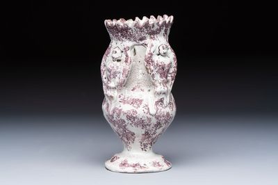 A continental manganese- and white-splashed pottery money bank, 18/19th C.