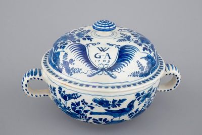 A dated Dutch Delft blue and white round bowl with cover for spiced wine, ca. 1709