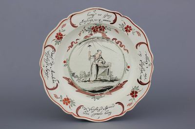 A Dutch-decorated English Leeds orangist creamware plate, 18th C.