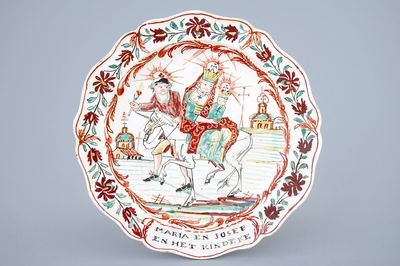 A Dutch-decorated Leeds creamware plate depicting "The flight into Egypt", 18th C.