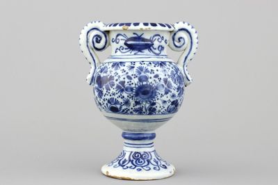 A Dutch Delft blue and white altar vase, early 18th C.