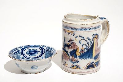 A Dutch Delft blue and white chinoiserie bowl and a polychrome Braunschweig mug, 1st half 18th C.