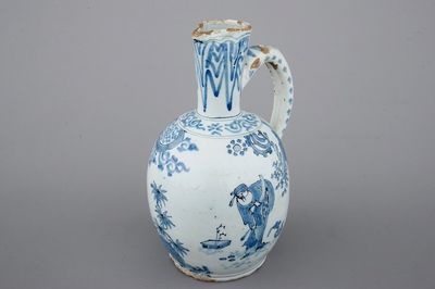 A Dutch Delft blue and white chinoiserie jug, 17th C.