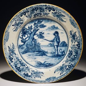 A Dutch Delft blue and white dish depicting "The young fisherman" after Bloemaert, 18th C. — photo 1