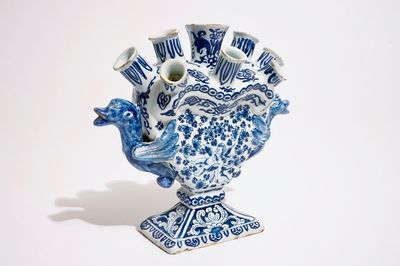 A Dutch Delft blue and white heart-shaped tulip vase with cupids, ca. 1700