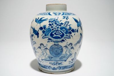 A Dutch Delft blue and white jar with putti design, 18th C.