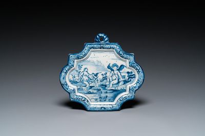 A Dutch Delft blue and white plaque depicting Amor and Psyche, 18th C.