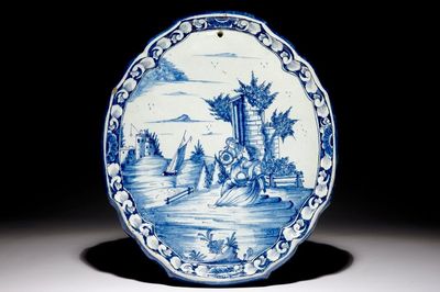 A Dutch Delft blue and white plaque with a pastoral scene, 18th C.