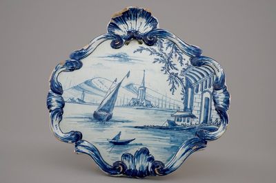 A Dutch Delft blue and white plaque with a sailboat, 18th C.