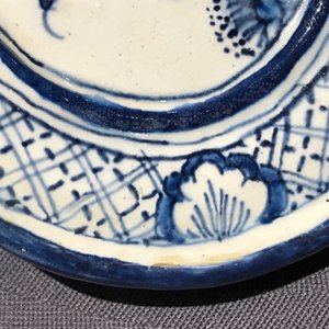 A Dutch Delft blue and white plaque with birds among flowers, 18th C. — photo 8