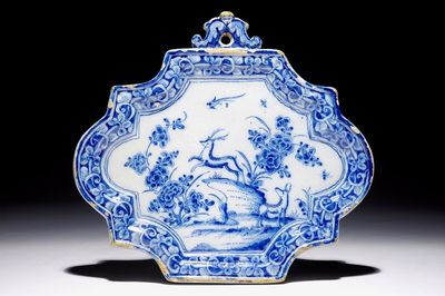 A Dutch Delft blue and white plaque with deers in a landscape, 18th C.