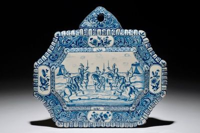 A Dutch Delft blue and white plaque with horserides, 18th C.