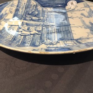 A Dutch Delft blue and white plate with peasants from the 'Zodiac' series, first quarter 18th C. — 照片 5