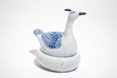 A Dutch Delft blue and white plover-shaped butter tub, 18th C.