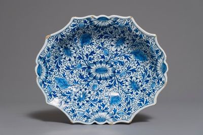 A Dutch Delft blue and white salad bowl with lotus scrolls, 18th C.