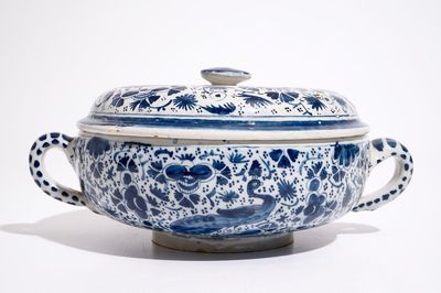 A Dutch Delft blue and white spiced wine bowl and cover with peacocks, early 18th C.