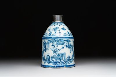 A Dutch Delft blue and white tea caddy with a pipe smoker, 18th C.