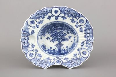 A Dutch Delft blue and white "tea tree" pattern barber's bowl, 18th C.