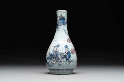 A Dutch Delft blue, white and manganese chinoiserie bottle vase, late 17th C.