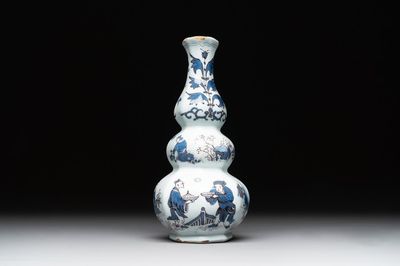 A Dutch Delft blue, white and manganese chinoiserie triple gourd vase, late 17th C.