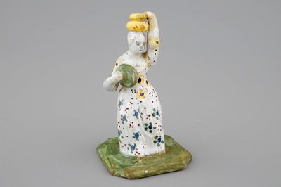 A Dutch Delft figure of a lady, 18th C.